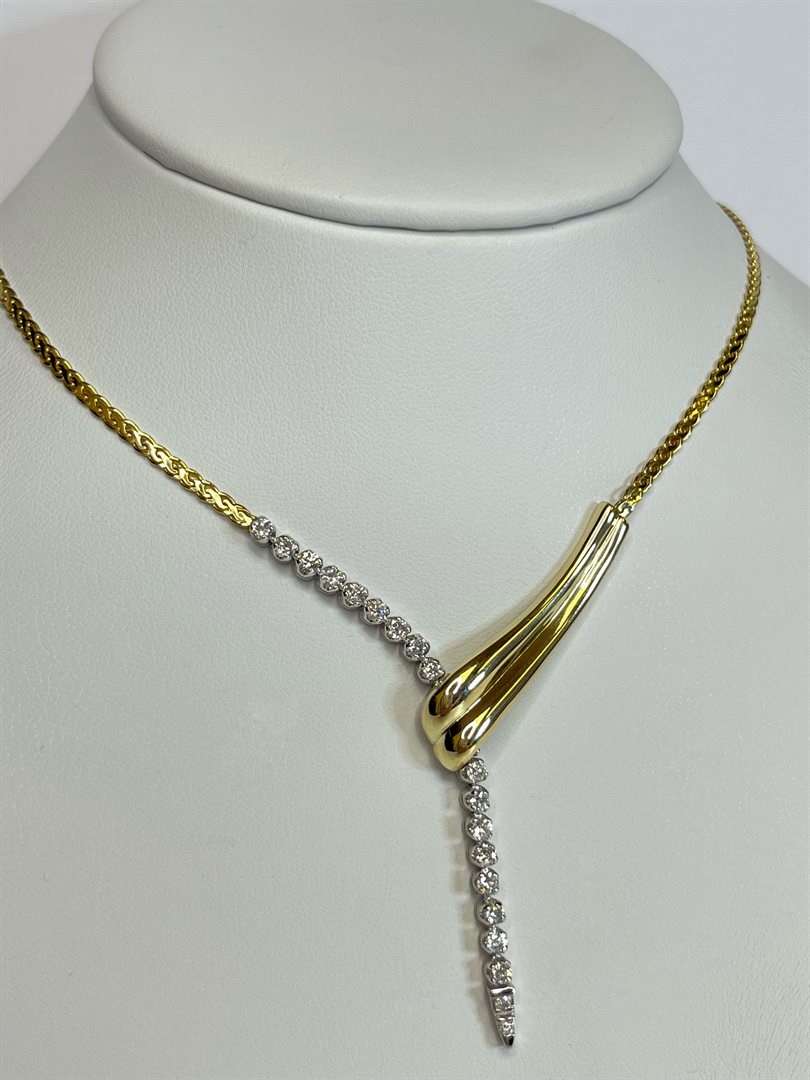 14k yellow gold diamond drop necklace, 1 carat total weight, on a display bust